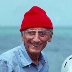 smiling Jacques in a red hat